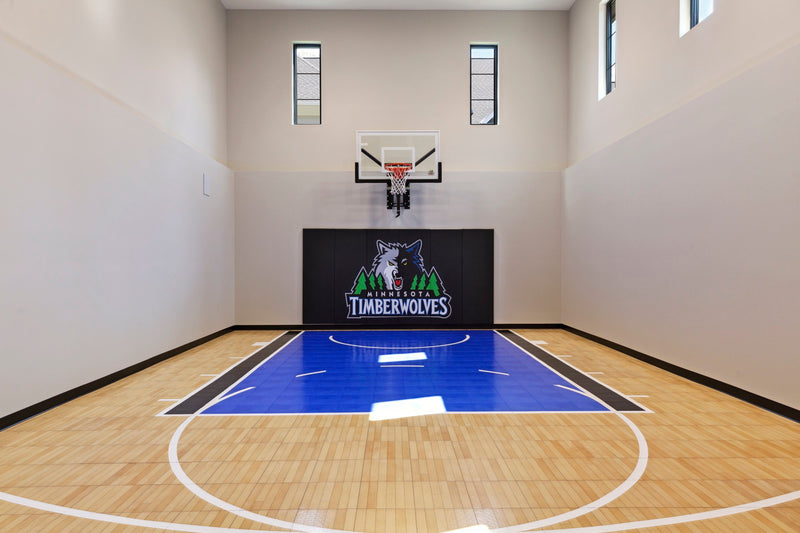 Gladiator wall-mounted basketball hoop installed in an indoor court