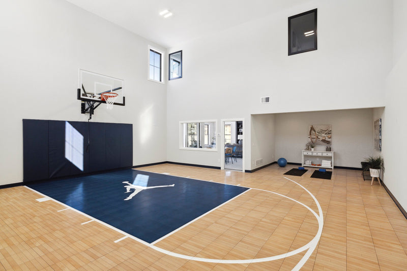 Gladiator wall-mounted basketball hoop installed in an indoor court