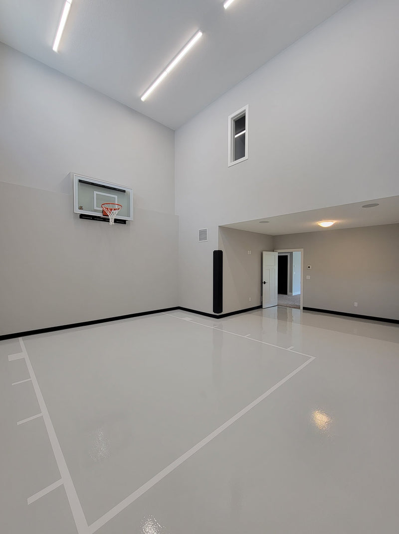 Gladiator wall-mounted basketball hoop installed in an indoor court