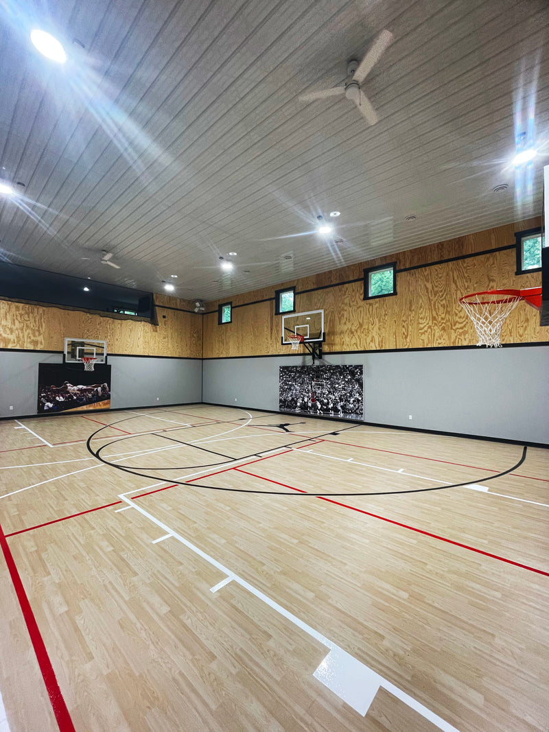 Gladiator wall-mounted basketball hoop installed in an indoor court