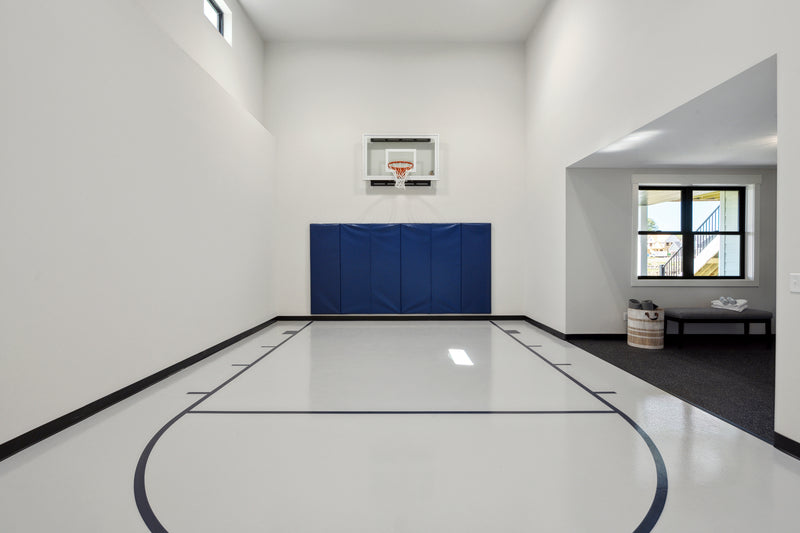 Gladiator wall-mounted basketball hoop installed in an indoor court