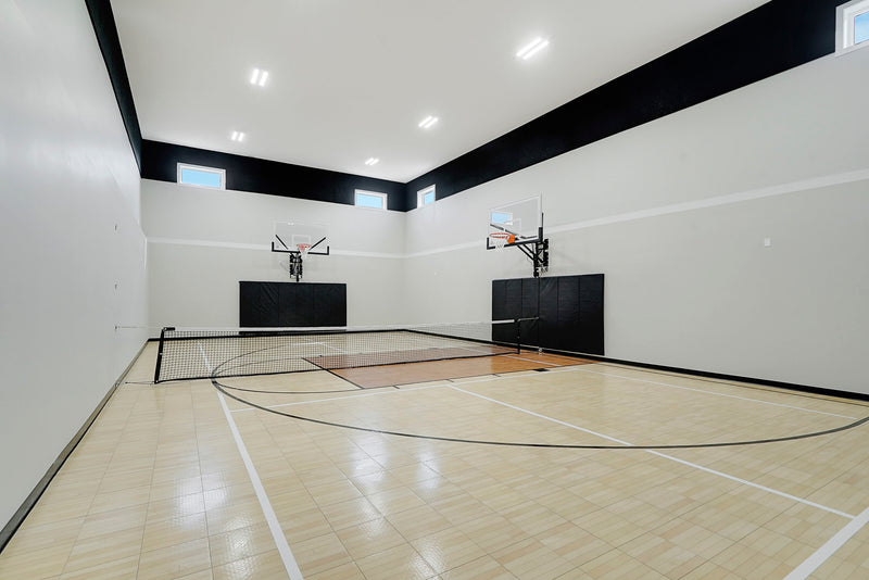 Gladiator wall-mounted basketball hoop installed in an indoor court