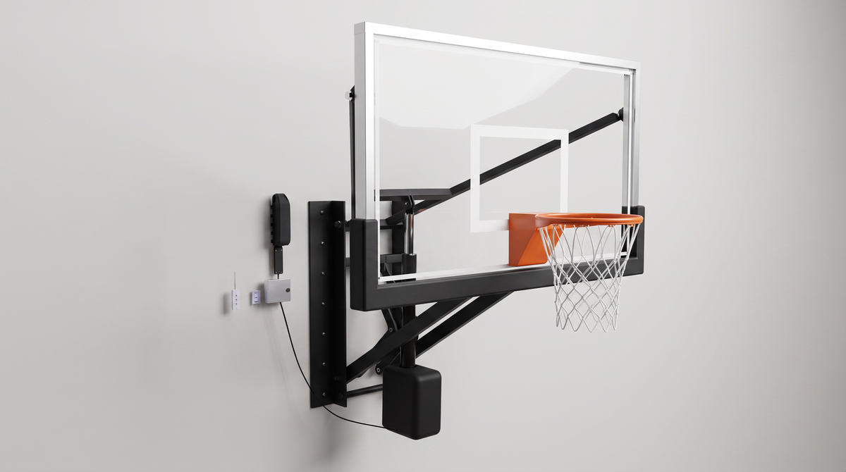 Gladiator battery powered adjustable wall-mounted basketball hoop with tempered glass backboard, motor housing on the arm, wall-mounted remote holder and stainless steel receiver box