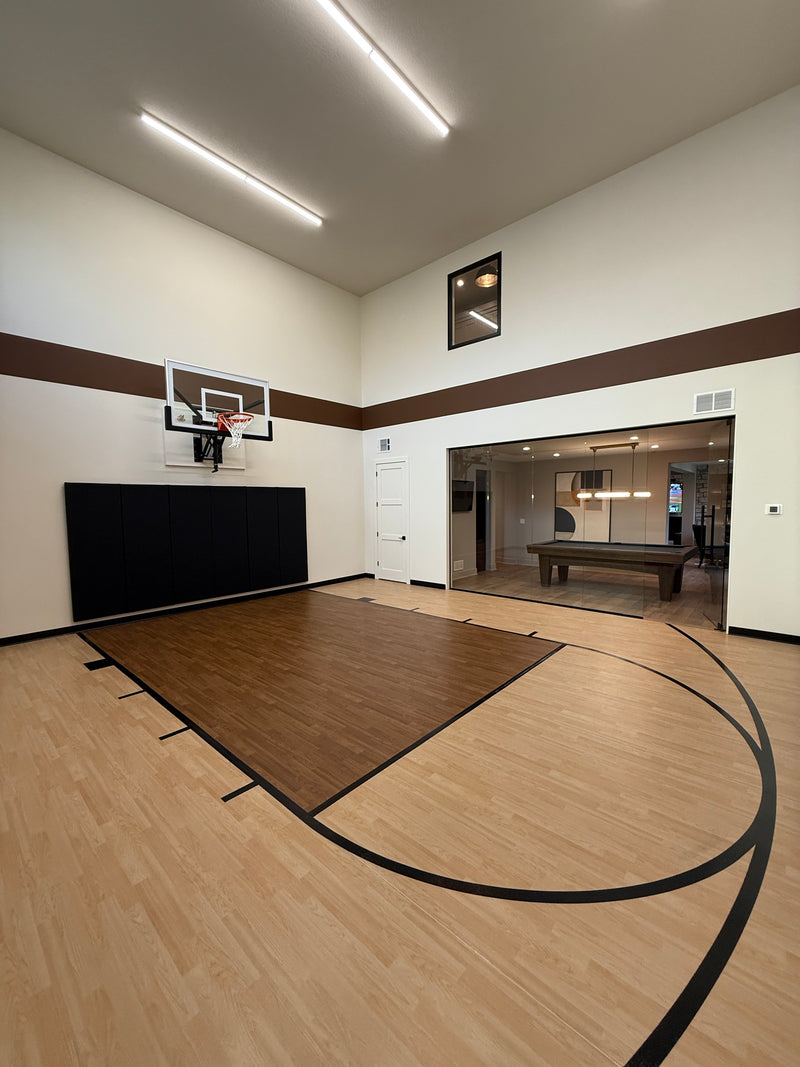 Gladiator wall-mounted basketball hoop installed in an indoor court