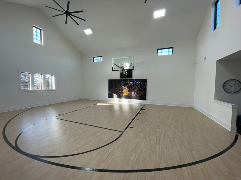 Gladiator wall-mounted basketball hoop installed in an indoor court