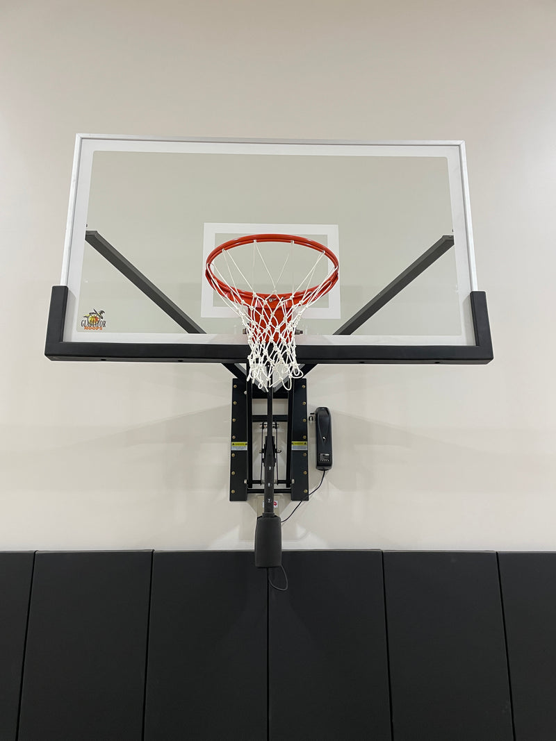 Gladiator wall-mounted basketball hoop installed in an indoor court