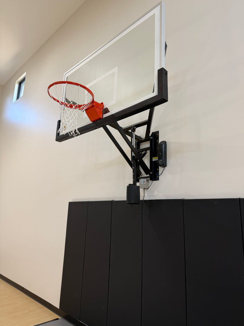 Gladiator wall-mounted basketball hoop installed in an indoor court