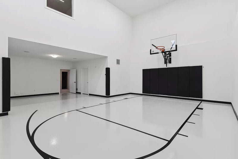 Gladiator wall-mounted basketball hoop installed in an indoor court