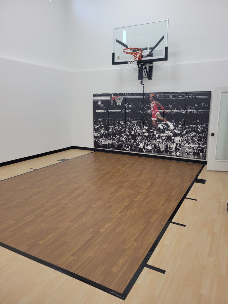 Gladiator wall-mounted basketball hoop installed in an indoor court