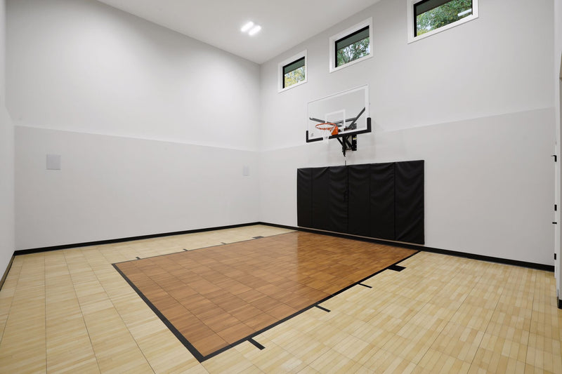 Gladiator wall-mounted basketball hoop installed in an indoor court